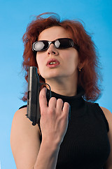 Image showing woman with pistol