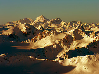 Image showing Decline above snow-covered tops.