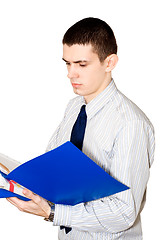 Image showing The young man reads documents