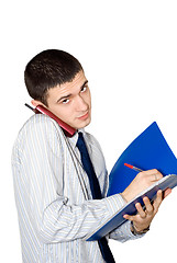 Image showing The young man speaks by phone