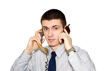 Image showing The young man speaks by phone