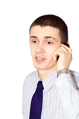 Image showing The young man speaks to phone