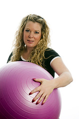 Image showing pretty middle age woman exercising with dumbells