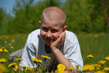 Image showing smiling teen boy on grass