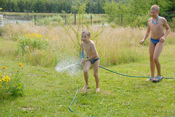 Image showing boys play on the grass