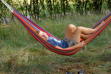 Image showing boy in a hammock