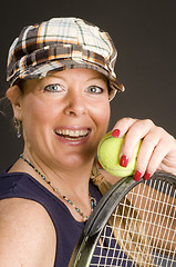 Image showing woman practicing tennis stroke