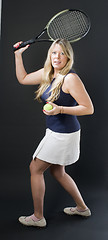 Image showing woman practicing tennis stroke