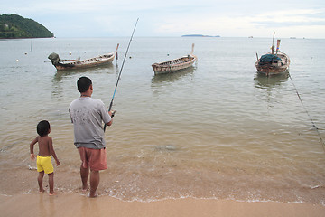 Image showing Fisherman and his child