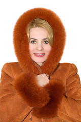 Image showing The young woman in a red sheepskin coat