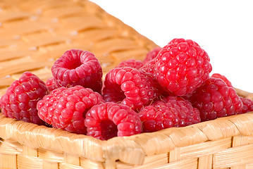 Image showing Bast-basket with a raspberry