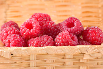 Image showing Bast-basket with a raspberry