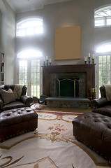 Image showing large living room with leather chairs and fireplace