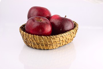 Image showing Red apples in a wicker plate