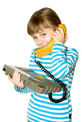 Image showing The girl with yellow phone