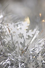 Image showing Snowflake and tinsel