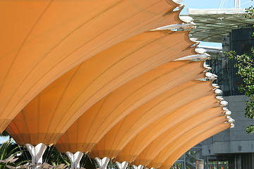 Image showing Photo of a patio umbrellas at a cafe