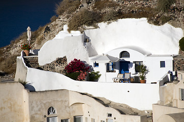 Image showing  villa built into volcanic cliffs in cyclades architecture oia i