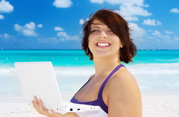 Image showing woman with laptop computer on the beach