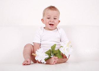 Image showing Baby with flowers