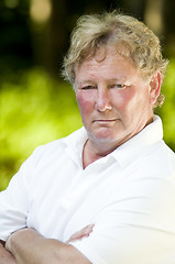 Image showing serious middle age senior tennis player male