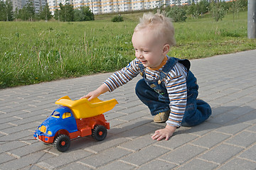 Image showing Child with a toy truck