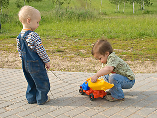 Image showing Children with a toy truck