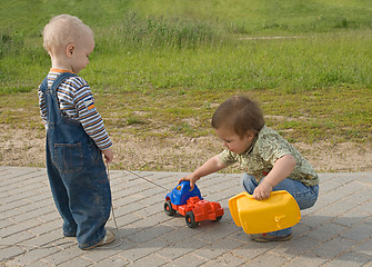 Image showing Children with a toy truck