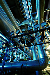 Image showing Equipment, cables and piping as found inside of a industrial pow