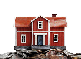 Image showing Model of house on pile of coins