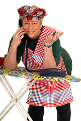 Image showing Housewife ironing