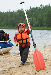 Image showing Little boy with an oar