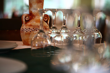 Image showing A colorful pottery vase on a dinning table