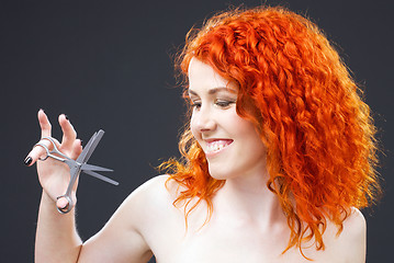 Image showing redhead with scissors