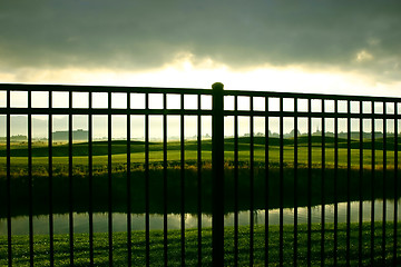 Image showing Sunrise Behind the Fence