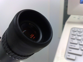 Image showing Microscope eyepiece in foreground