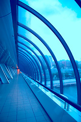 Image showing glass corridor with bright-red window