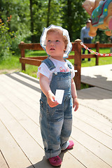 Image showing small girl with ticket in hand