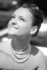 Image showing smiling girl with pearl necklace, monochrome