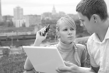 Image showing man with white laptop and girl