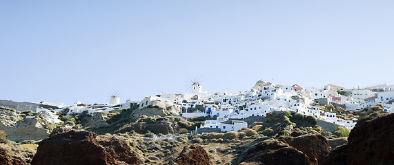 Image showing oia santorini town built into volcanic cliffs panorama view