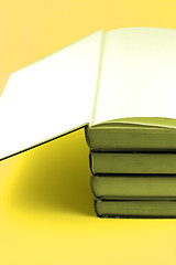 Image showing Books Stacked Up - Yellow Background