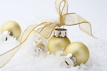 Image showing Gold Christmas bauble decorations with ribbon.