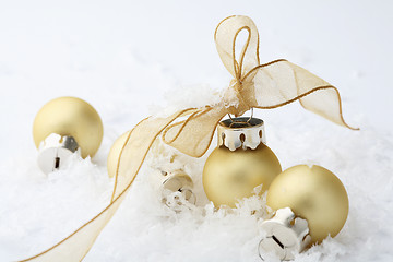 Image showing Gold Christmas bauble decorations with ribbon.