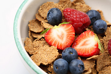 Image showing Bowl of breakfast cereal with fruit.