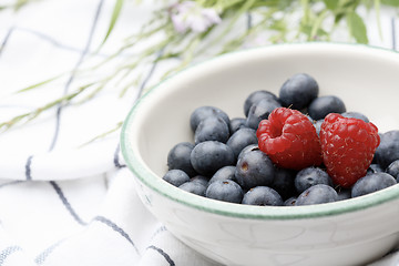 Image showing Fresh blueberries and raspberries in a bowl.