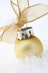 Image showing Gold Christmas bauble decoration with ribbon.