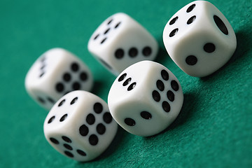 Image showing Gambling die on a green surface.