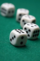 Image showing Gambling die on a green surface.