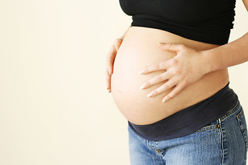 Image showing Woman holding her pregnant belly.